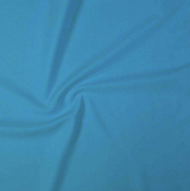 Close-up of a blue fabric with a smooth, slightly wrinkled texture.