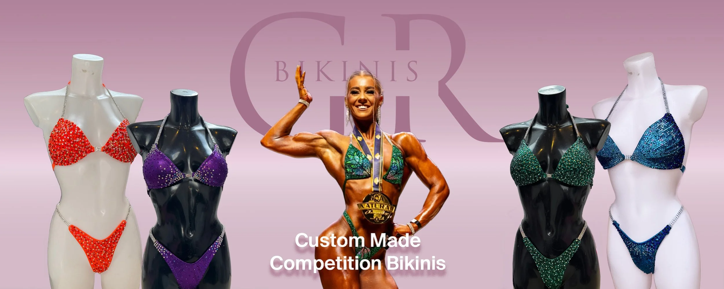 Display of four rhinestone bikinis on mannequins with a female bodybuilder in the center, flexing her arm, wearing a decorated competition bikini with a medal around her neck. The background is pink with the text 'Custom Made Competition Bikinis' and a logo.