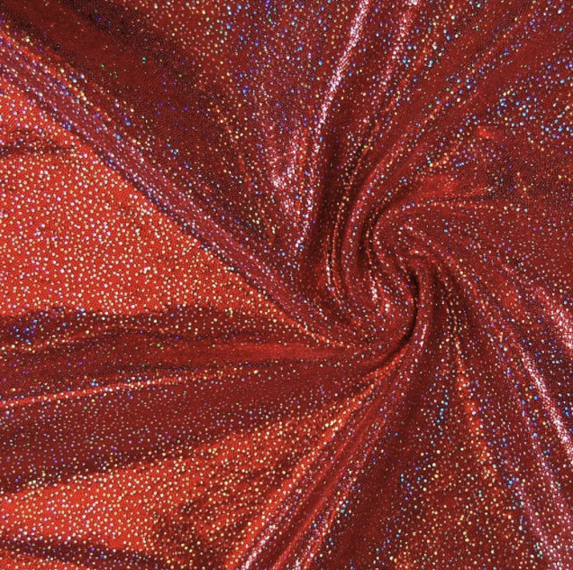 Red fabric with multicolored rhinestones swirling in a spiral pattern.