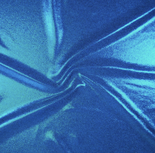 Close-up of a shiny, textured blue fabric with folds and creases.