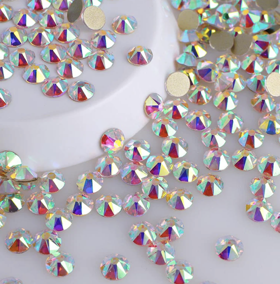 Pattern of red cherries with green leaves on pink background.