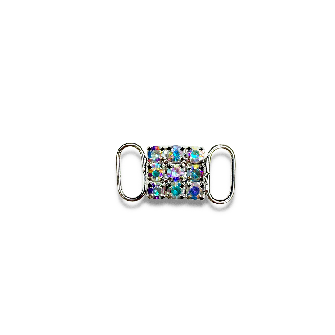 A rhinestone buckle with a rectangular pattern of multicolored sparkling stones on a white background.