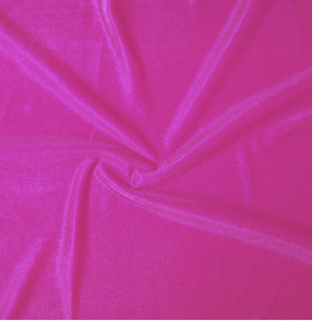 Close-up of bright pink fabric with a soft, shiny texture, slightly gathered in the center.