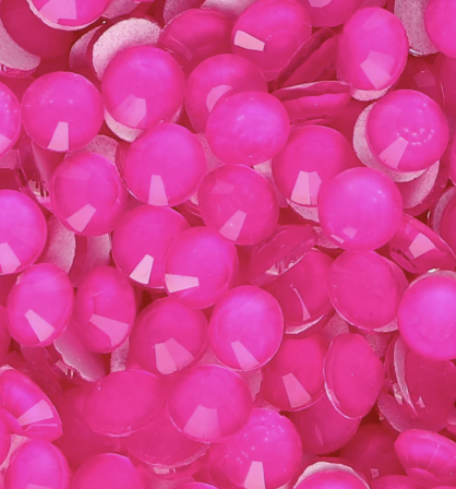 Close-up of shiny pink gumballs.
