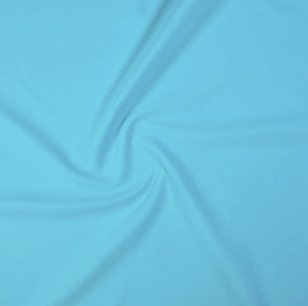 Close-up of light blue fabric with a soft, flowing texture.