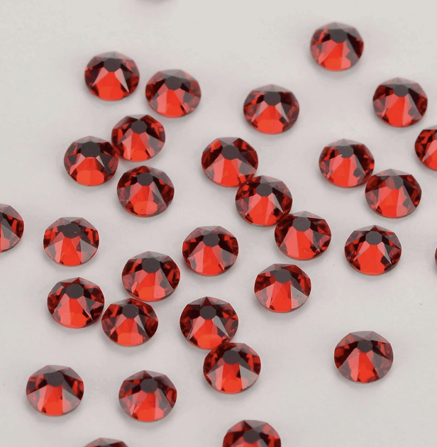 Pattern of red cherries with green leaves on a white background.