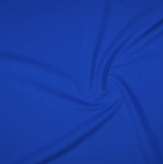 Close-up of a blue fabric with folds and creases.