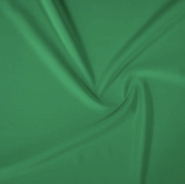 Green fabric with a spiral fold pattern.