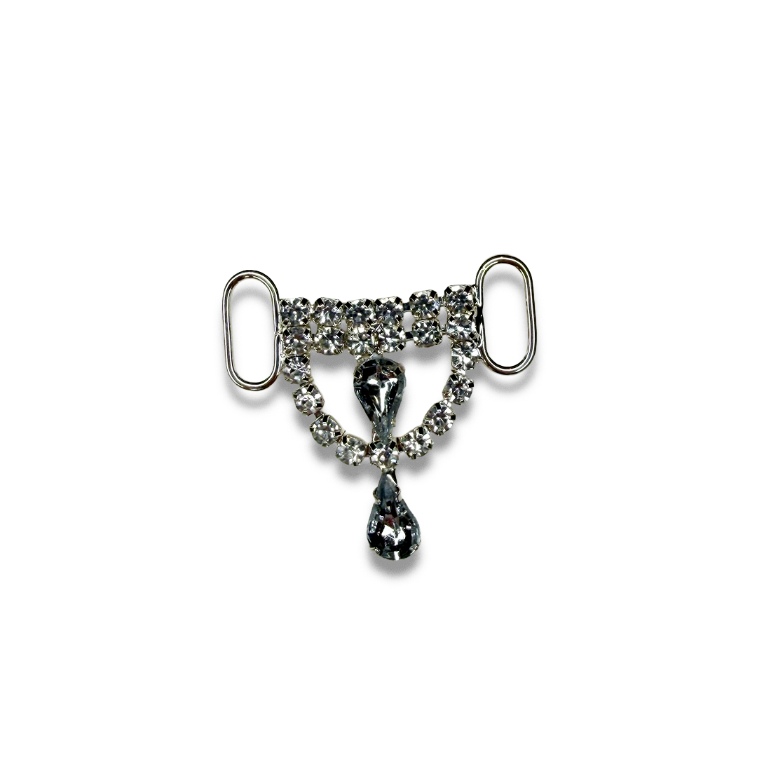 Silver rhinestone breast shield with two dangling teardrop-shaped rhinestones in the center.