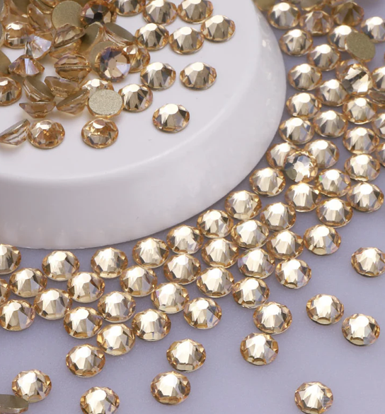 Pattern of red cherries with green leaves on a black background.