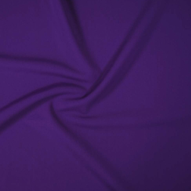 Close-up of purple fabric with folds and creases.