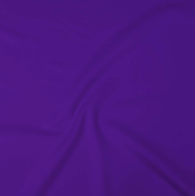 Close-up of a purple fabric with soft folds and wrinkles.