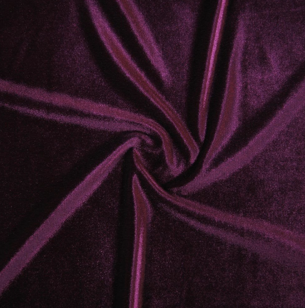 Close-up of purple velvet fabric twisted into a spiral pattern.