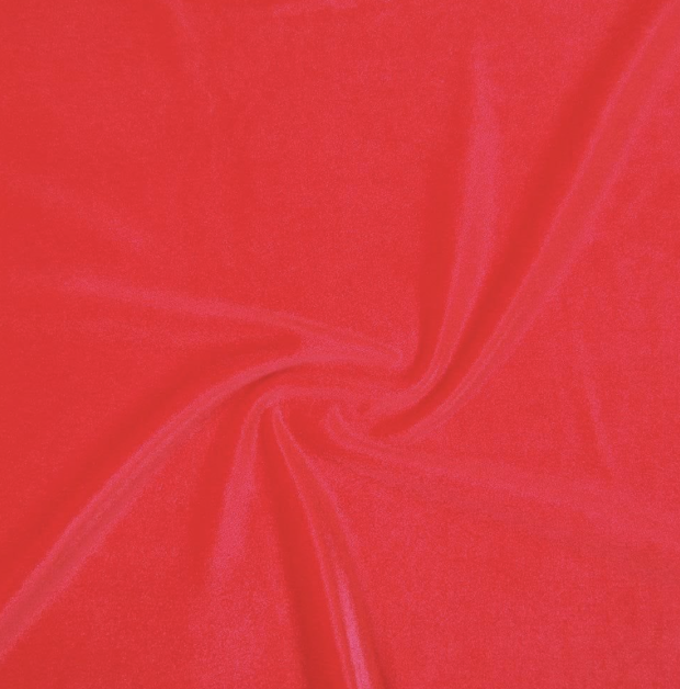 Close-up of pink fabric with a swirl pattern.