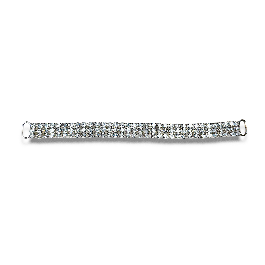 A silver bracelet encrusted with clear gemstones on a white background.