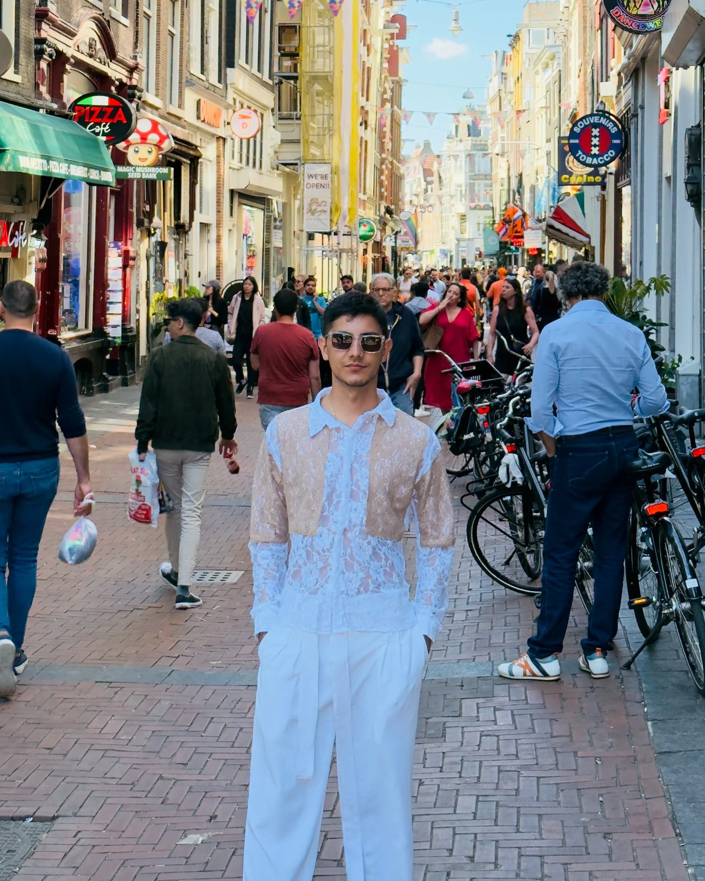 A man walking along a busy city street.