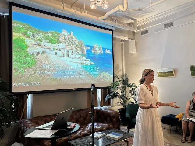 A woman giving a presentation about Sicily.