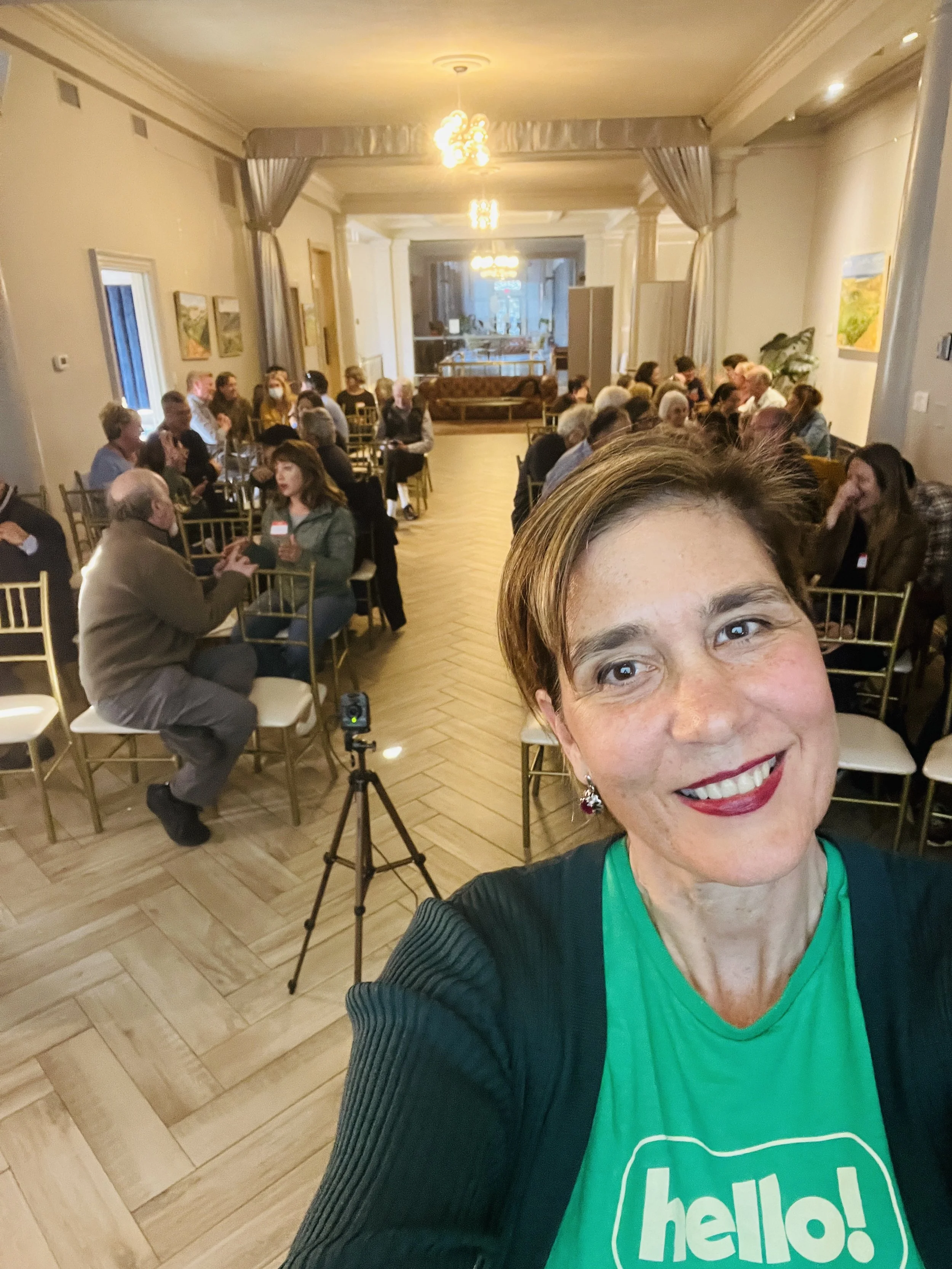 A woman taking a selfie during a group event.