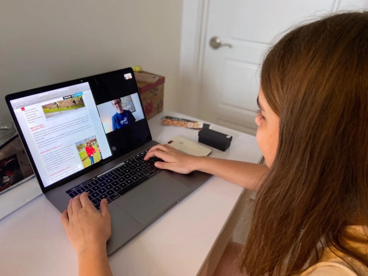 A learner participating in a laptop video call.