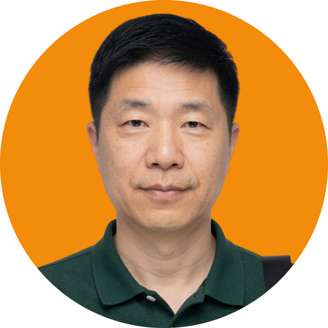 Portrait of a man wearing a green collared shirt.
