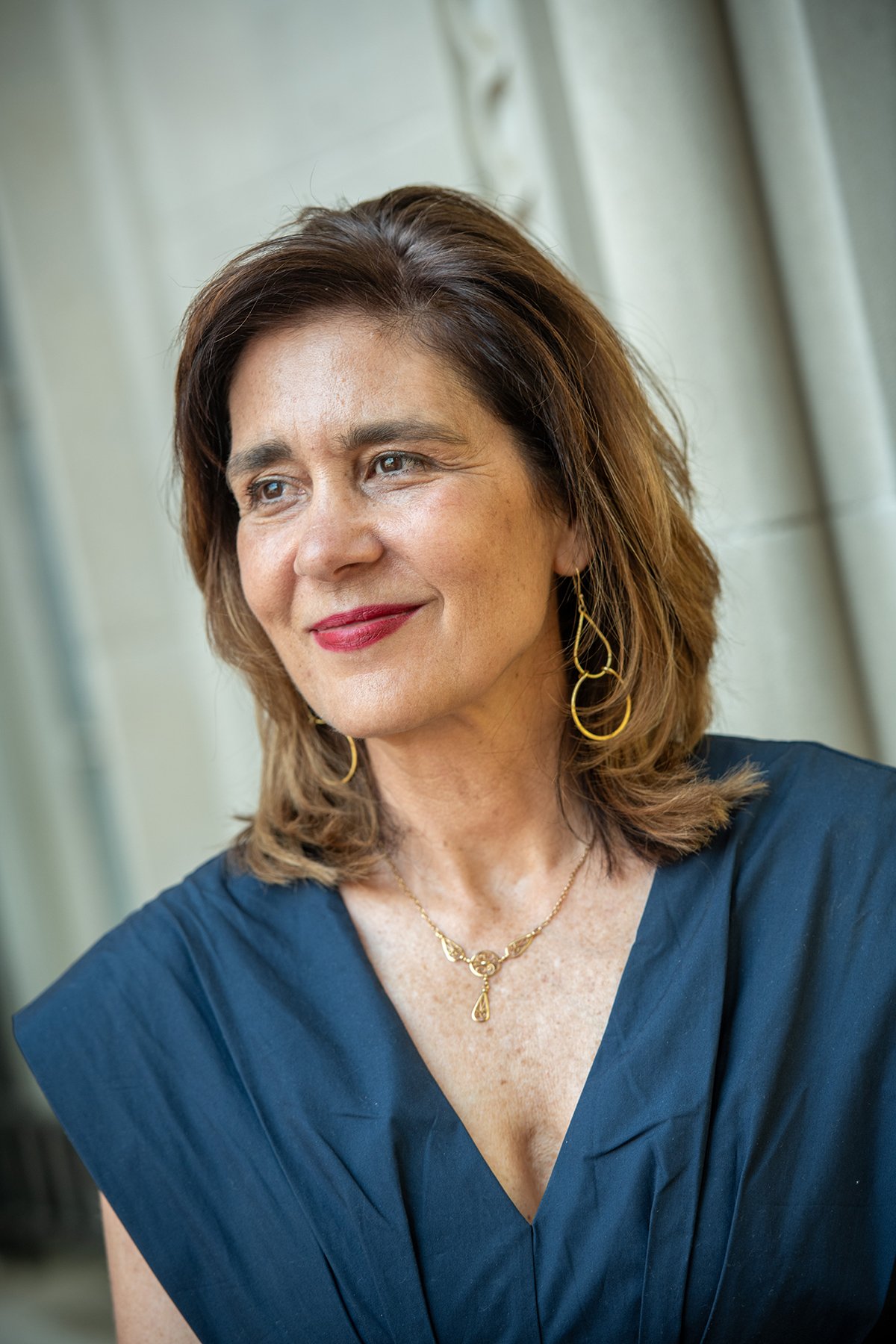 Portrait of a woman wearing a navy top.
