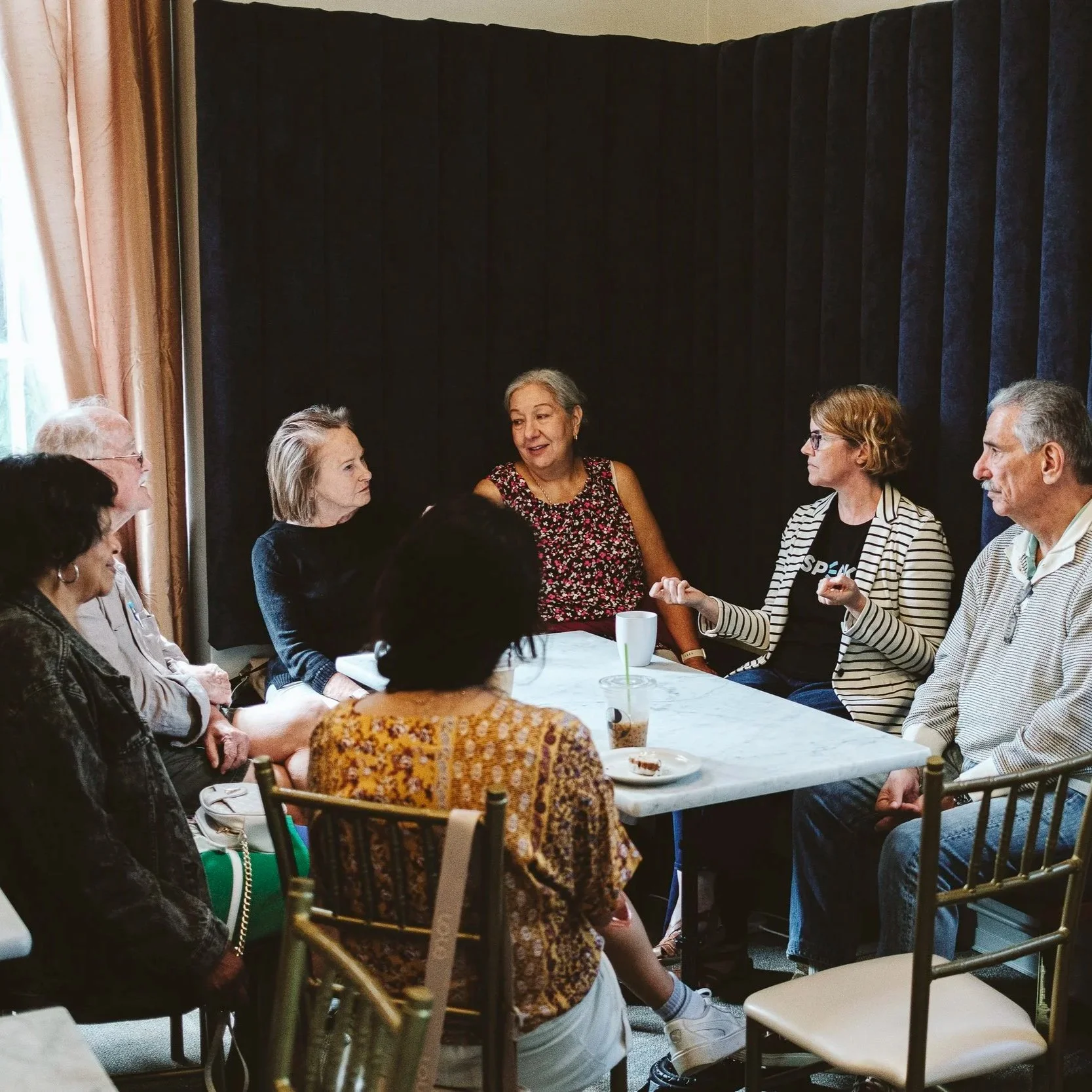 A group talking around a table.