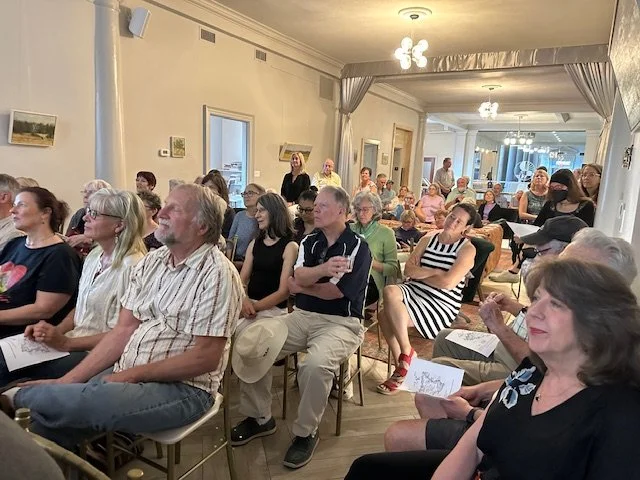 People seated at a community event.