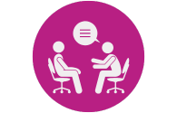 Two people sitting across from each other in an interview or counseling setting, with a speech bubble above them.