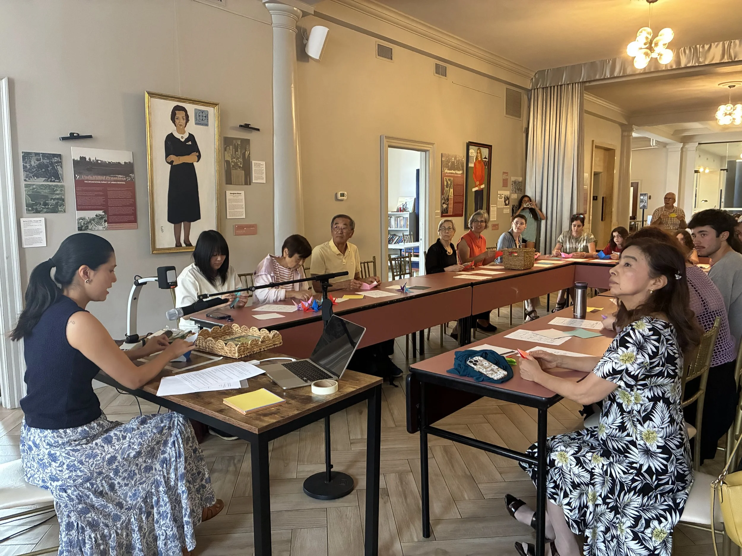 Participants seated around a conference table during a workshop.
