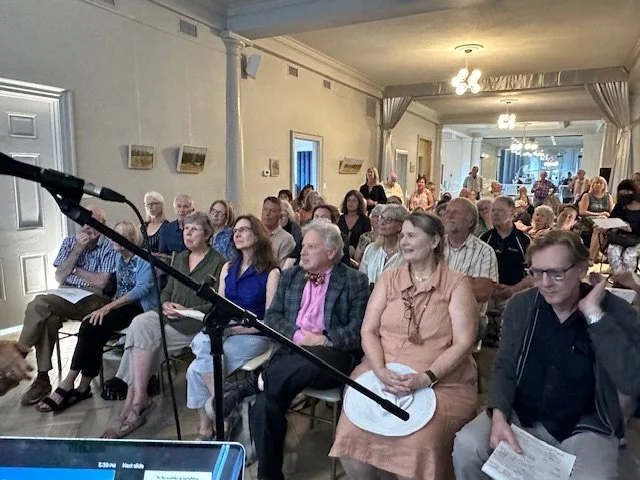 Audience members seated for a presentation.