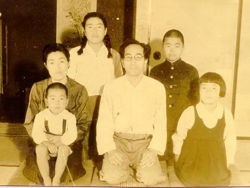A family portrait of the Miyamae family - the young Junichi with his two sisters and brother and his parents