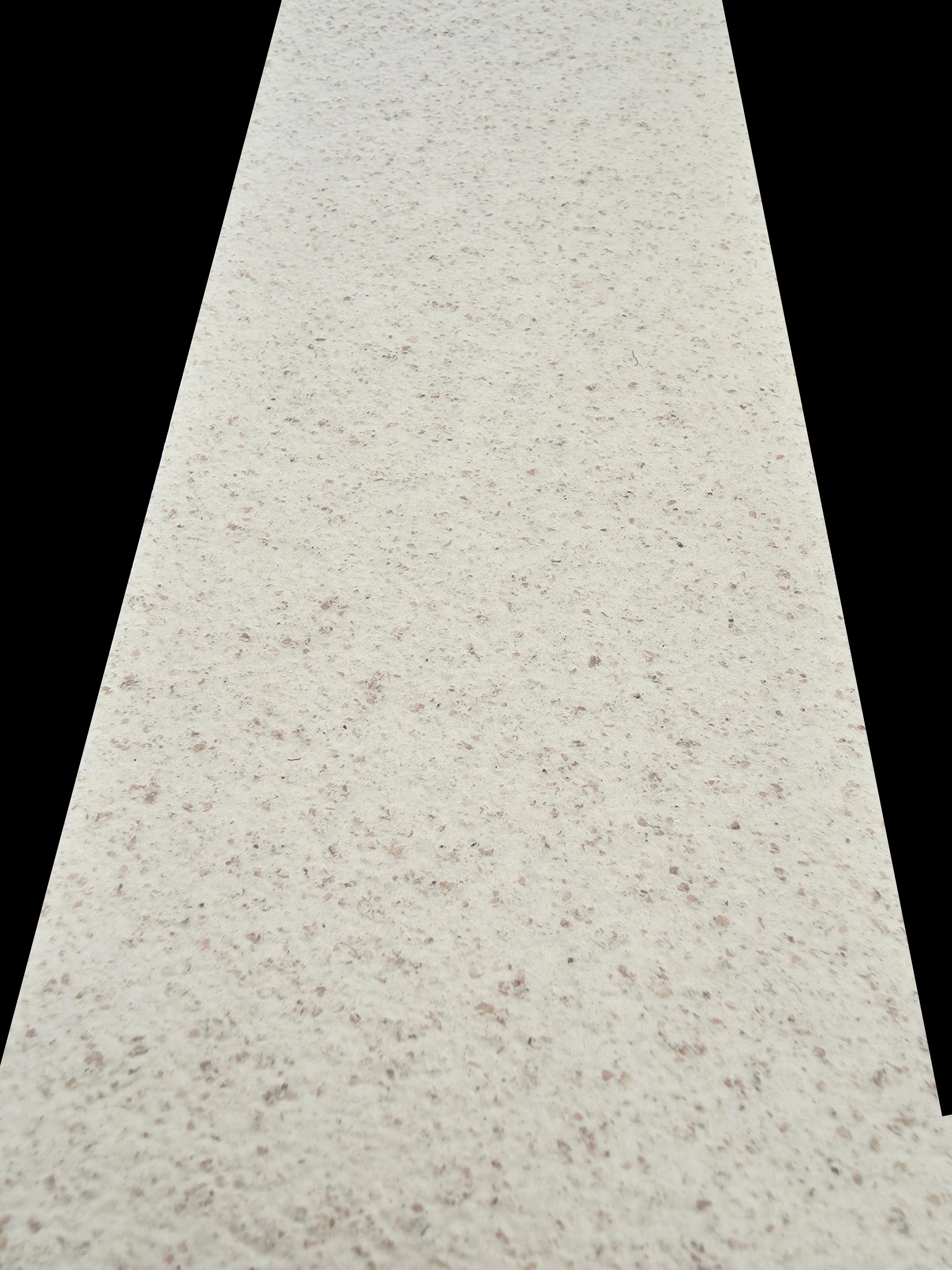 Superficie di un banco o pavimento chiaro con texture leggermente granulosa e superfice liscia