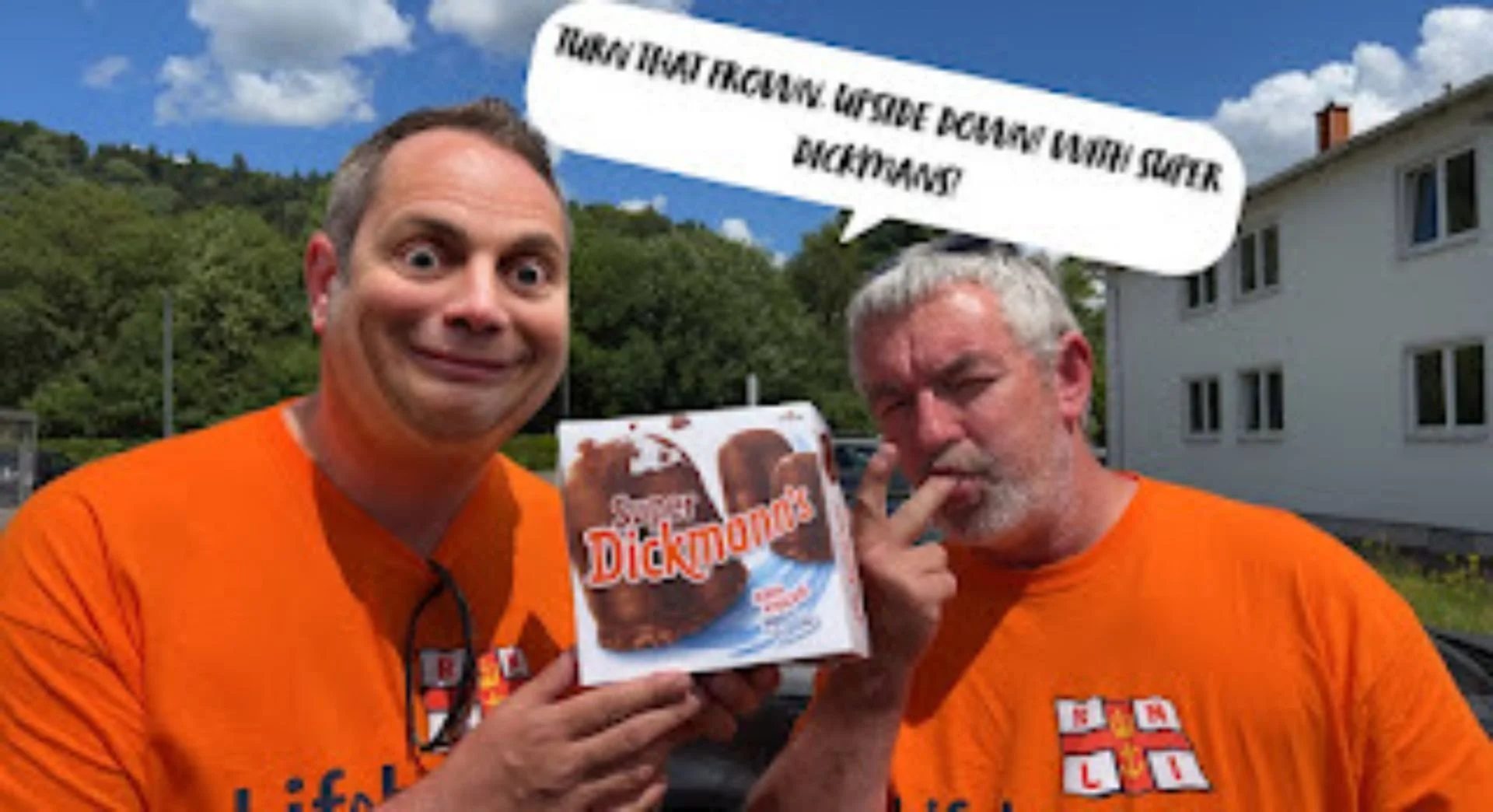Two men with gray hair and wearing orange shirts holding a DICKMANS ice cream sandwich box outdoors. One man has his eyes wide open, smiling, while the other is making a peace sign with his fingers near his face. A speech bubble above the second man 