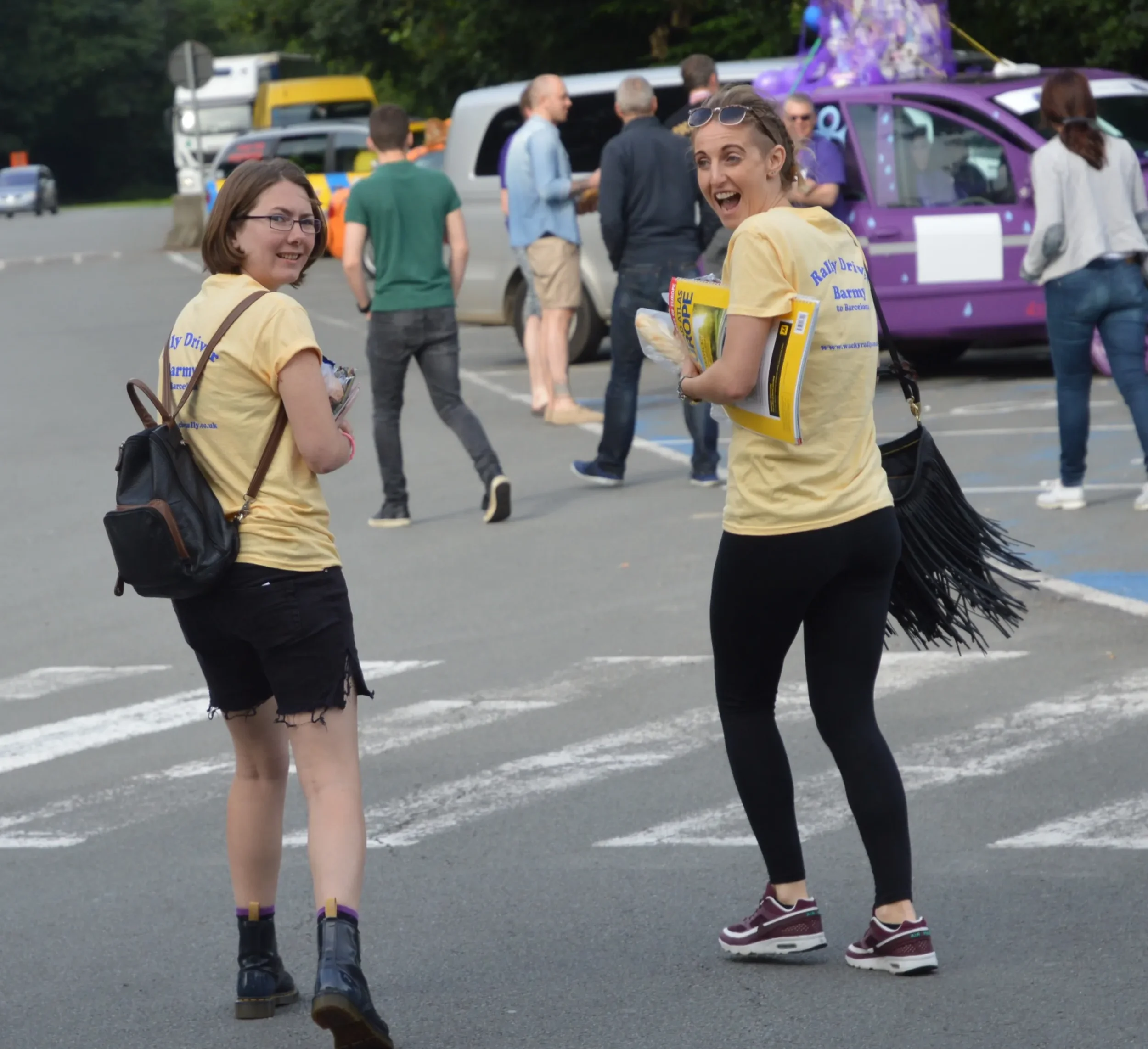Two women wearing yellow shirts with 