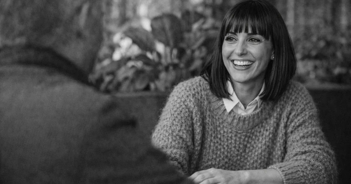 Image of a Smiling woman in meeting