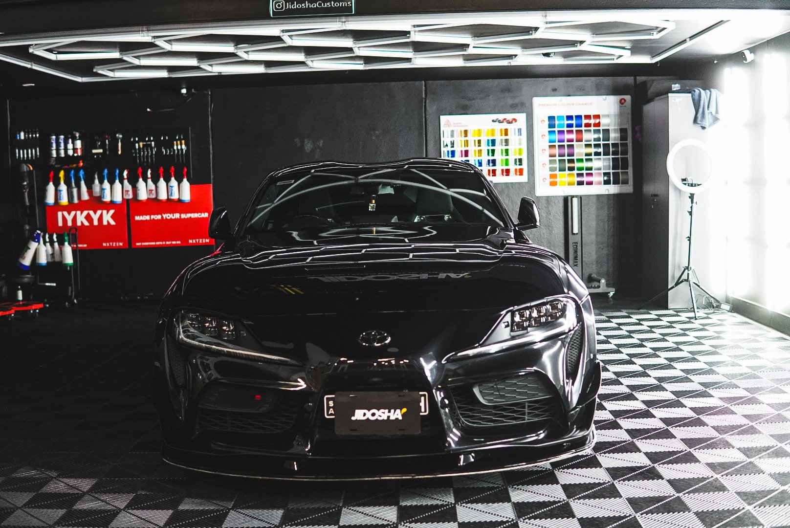 Black sports car for maintenance detailing