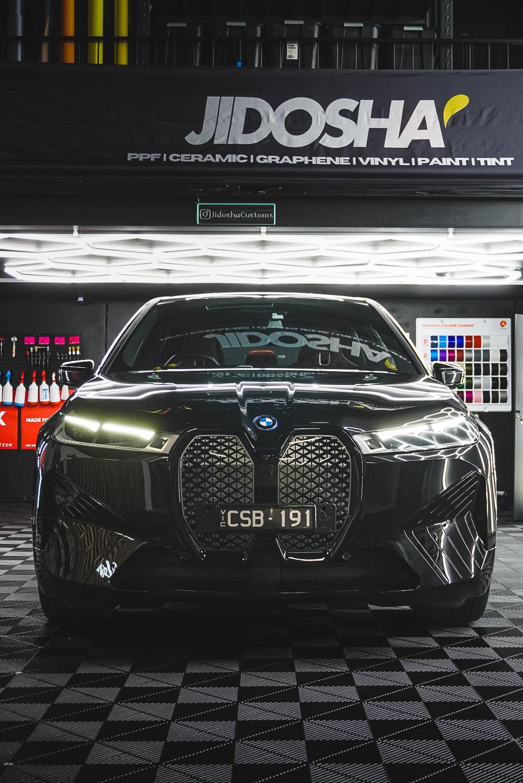 Black BMW car with a distinctive front grille 