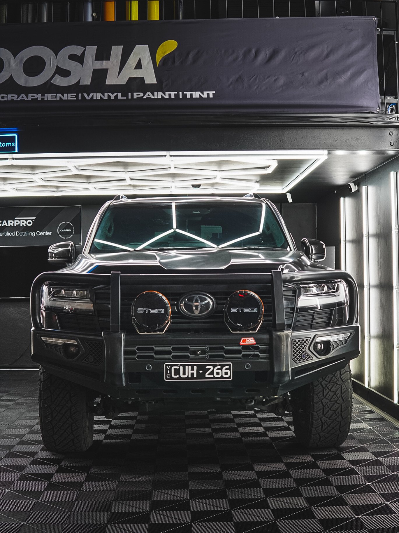 A black off-road vehicle equipped with a front bull bar