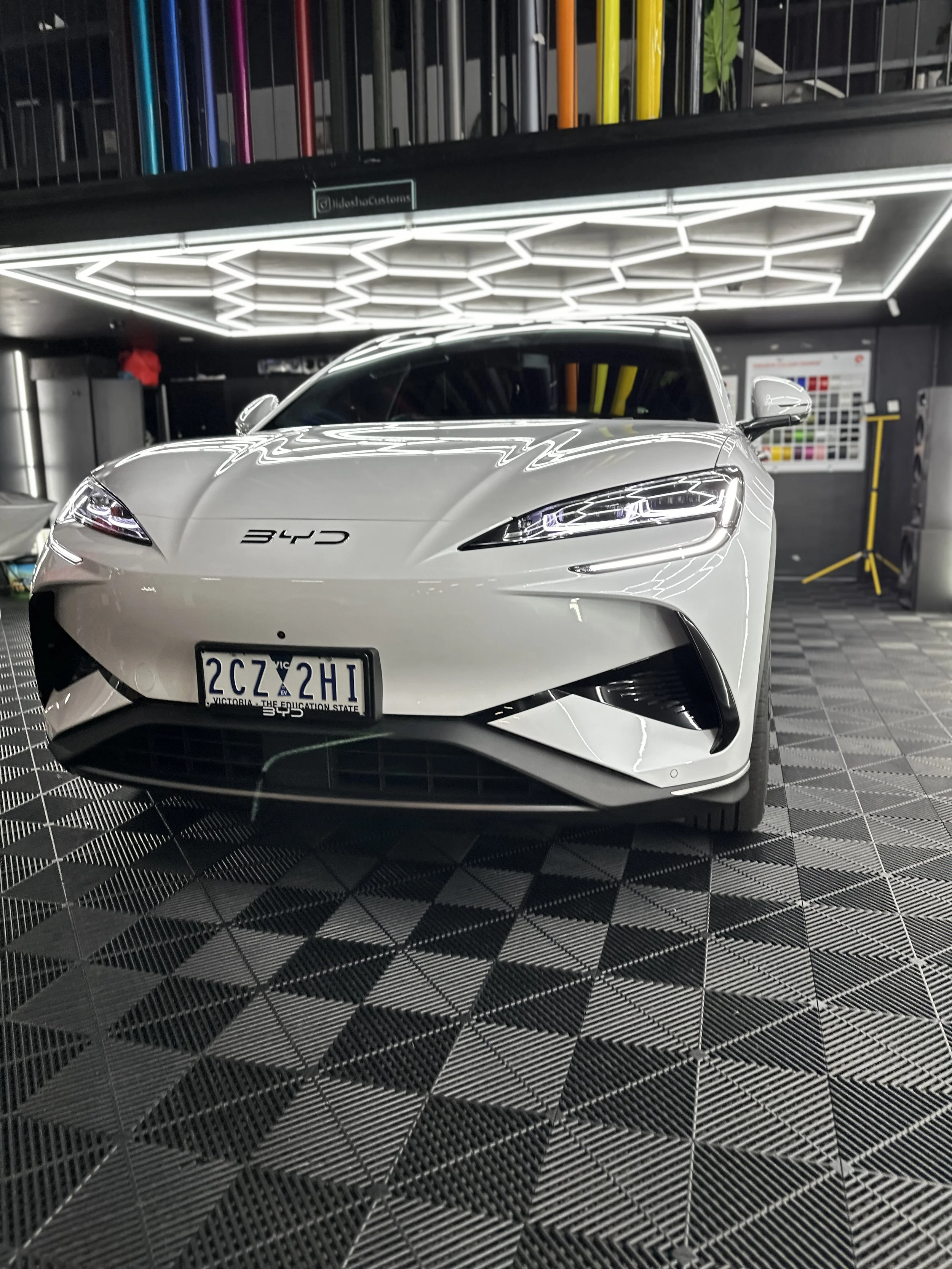 White BYD electric car at our detailing shop