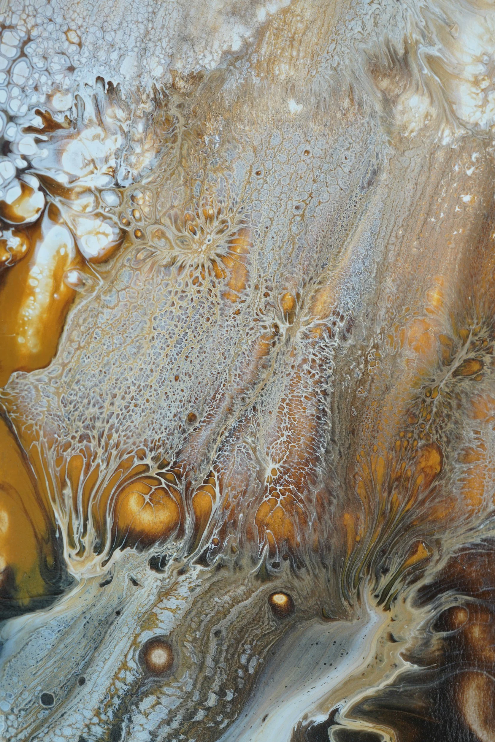 Abstract painting with swirling patterns in shades of white, beige, brown, and black.