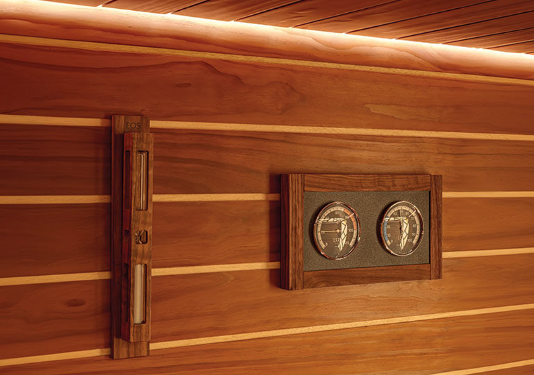 Wooden wall with two circular gauges and a vertical level.