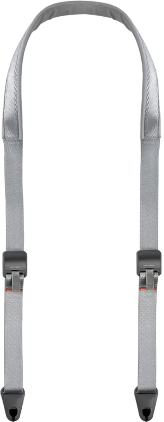 Cinghia di sicurezza di colore grigio con fibbie nere, usata per attività di arrampicata o alpinismo.