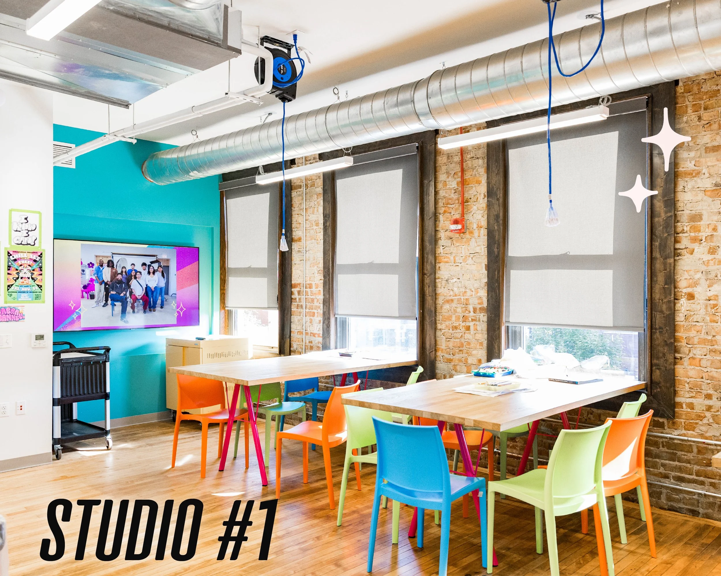 "Studio #1" reads the graphic text over an image of a bright workspace with brick walls, several tables and colorful chairs, and a turquoise accent wall.