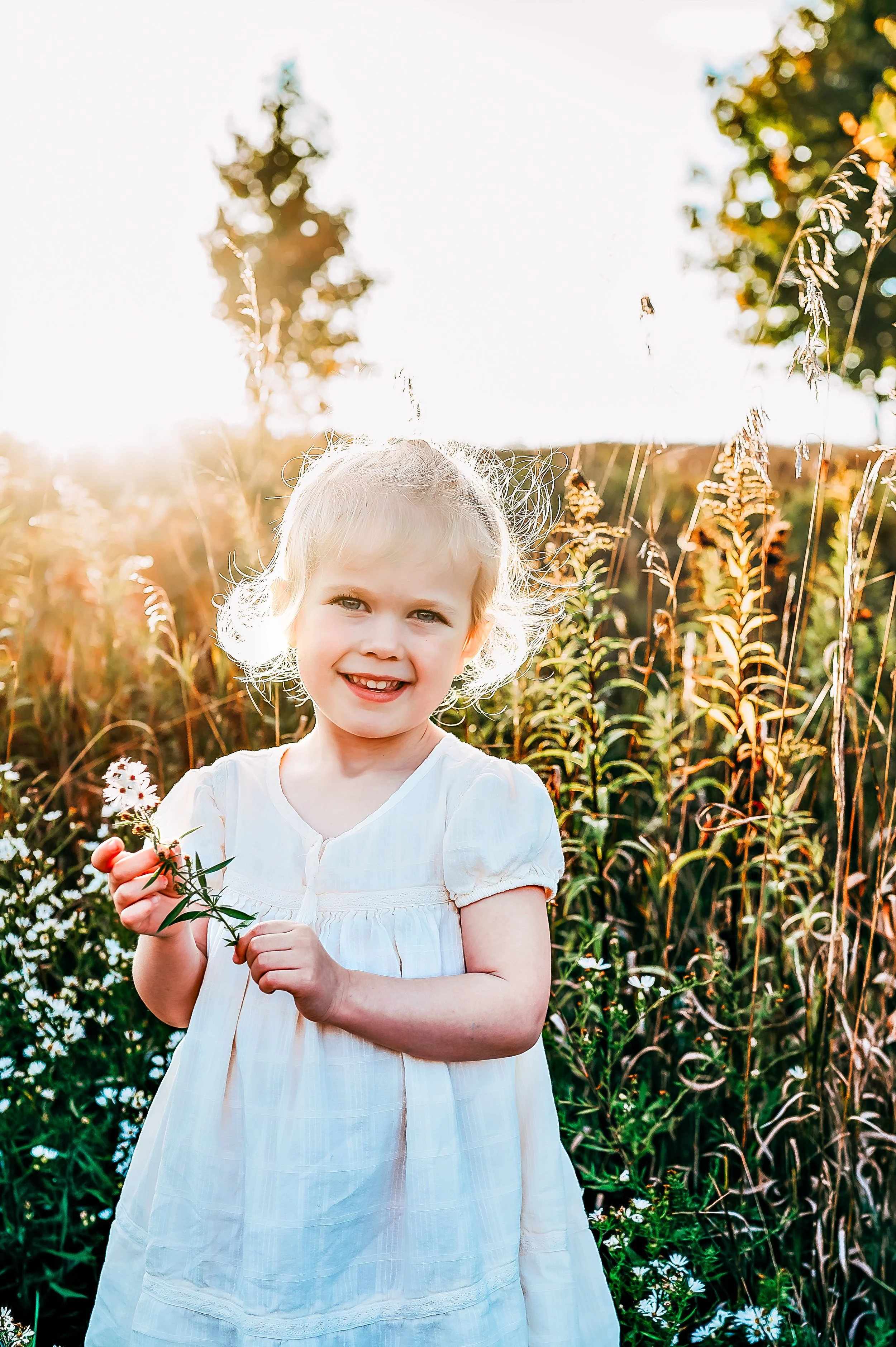 Outdoor lifestyle family photography session in Waterloo, Wisconsin with parents and young children at sunset 2.jpg