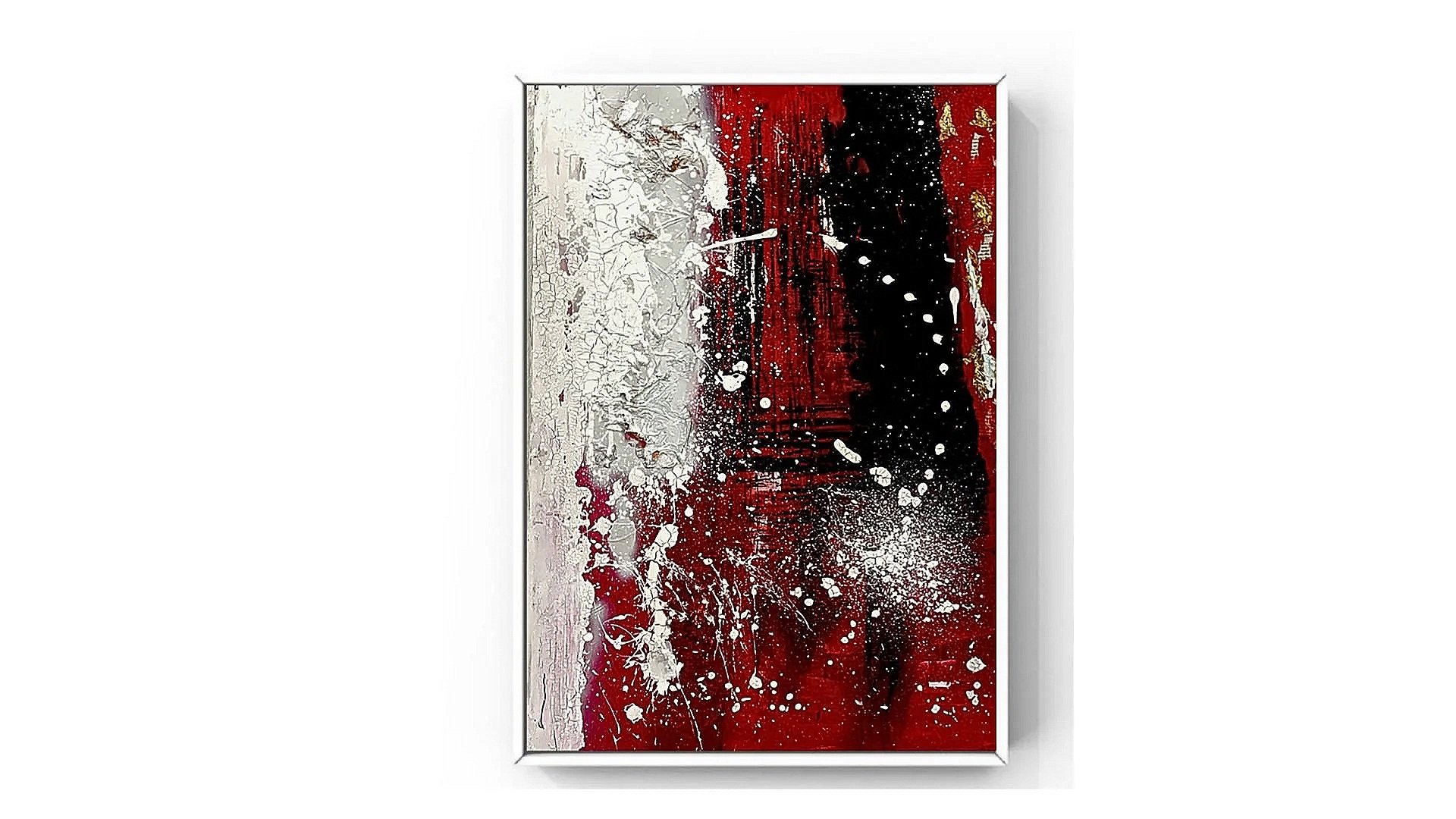 Abstract painting with white, black, and red splashes and textures framed on a white wall.