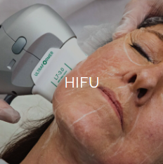 A woman receiving a high-intensity focused ultrasound (HIFU) facial treatment, with a device applied to her cheek.