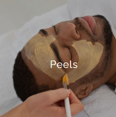 A person receiving a peel facial treatment with patches on their face, lying down with eyes closed, while a skincare professional applies a substance with a brush.