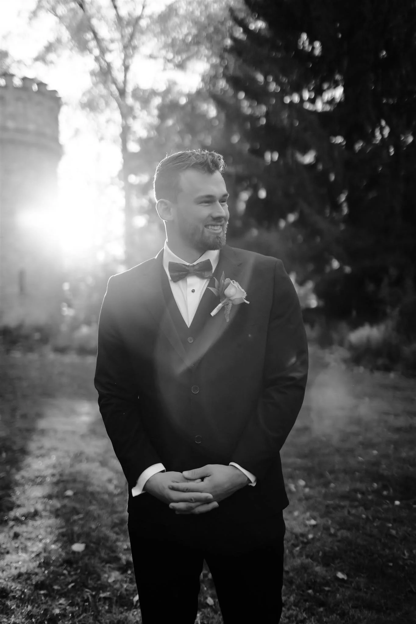 Zakary Edington modeling a three piece suit at Duke Sculpture Garden.
