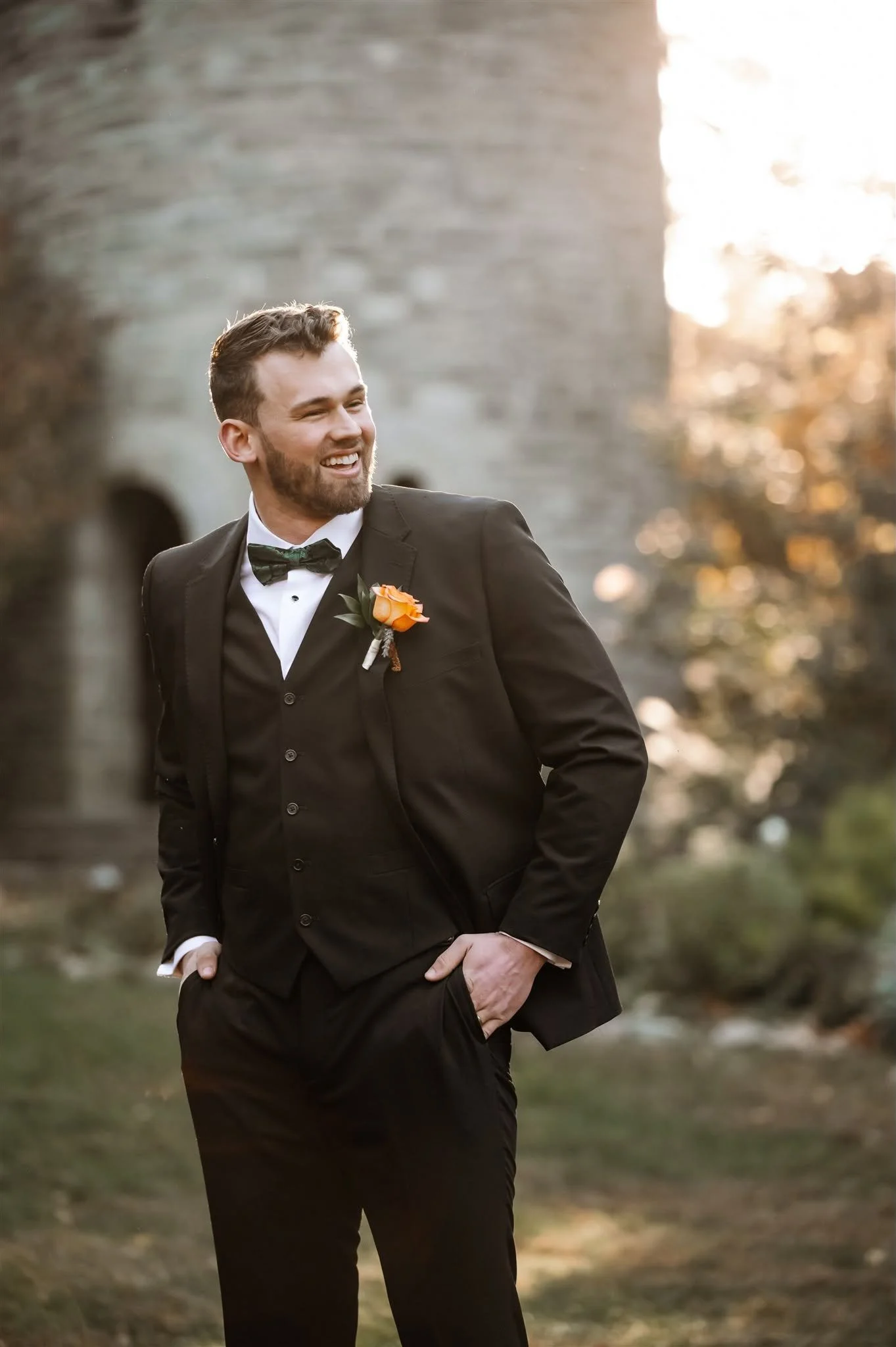 Zakary Edington in a full suit with a green bow tie.