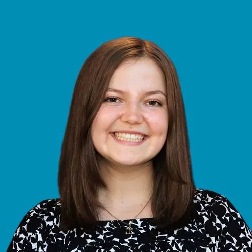 A photo of Emily Willard on a blue background.